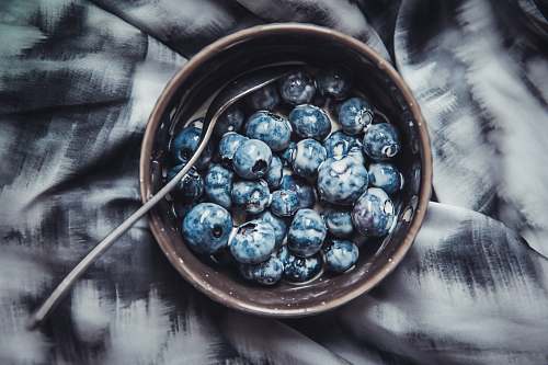 fruit blue berries with milk in brown ceramic bowl blueberry