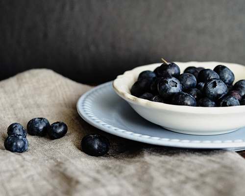 fruit blue berry fruit on top of white owl blueberry