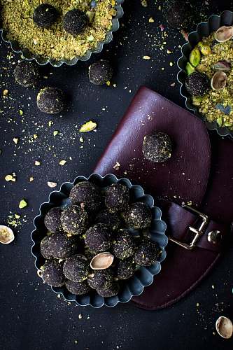 fruit bowl filled with chocolate coated nuts flora