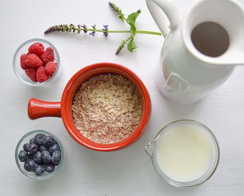 meal bowl of cereal near white pitcher breakfast