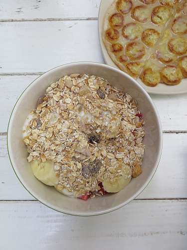 meal bowl of fruits topping with cereal oatmeal