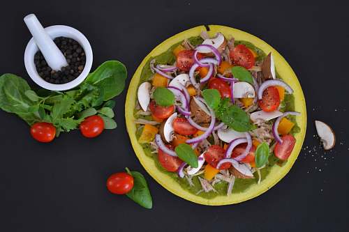 meal bowl of vegetables beside white cup dish