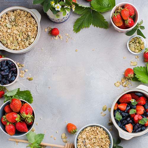 fruit bowls of strawberries and oats plant