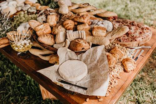 bread bread on brown wooden table outdoors bakery