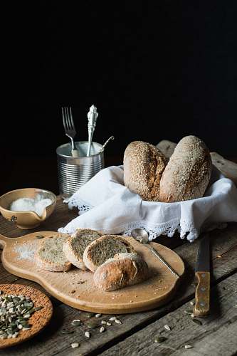 bread breads on brown chopping board bun