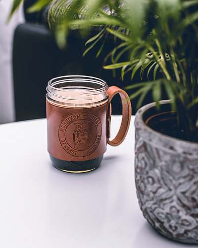 drink brown and clear glass mug on white surface beverage