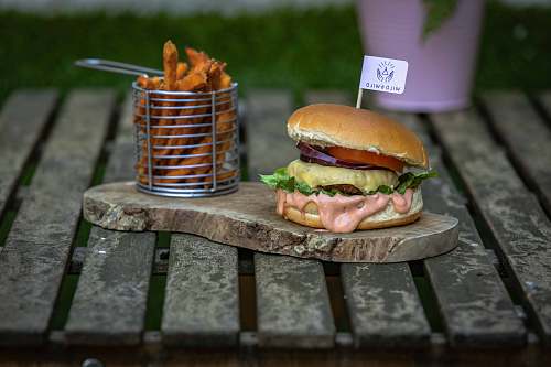 burger burger and fries on brown barble 
