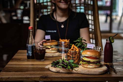 burger burger beside glass human