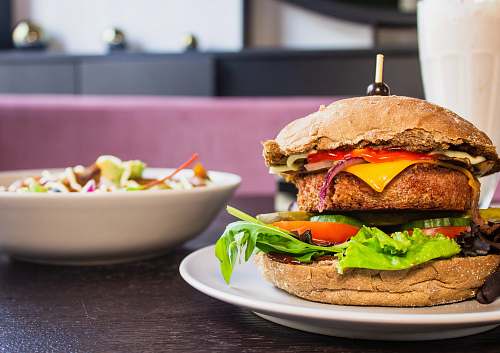 burger burger on round white plate 