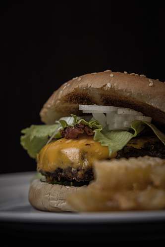 burger burger with ham, lettuce, and cheese yummy