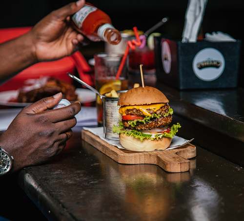 burger burger with sliced vegetable person