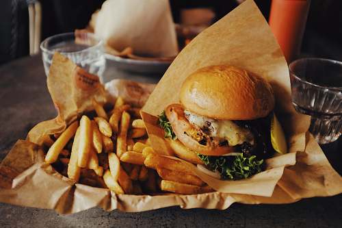 burger cheeseburger and fried potatoes person