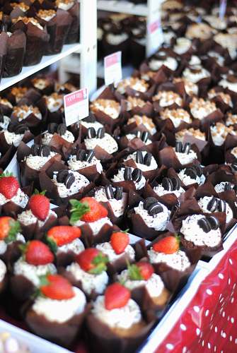 dessert chocolate cupcakes with strawberries and cookies pastry