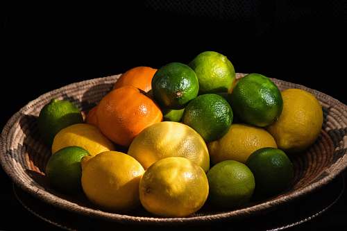 fruit citrus fruits in brown bowl lime
