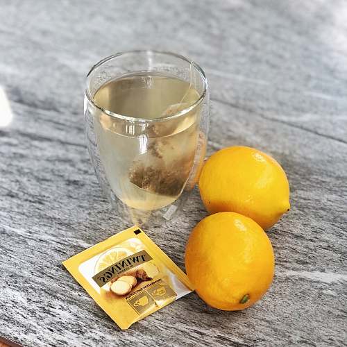fruit clear drinking glass beside lemonades citrus fruit