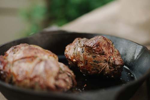 bbq close-up photo of cooked food on skillet meatball