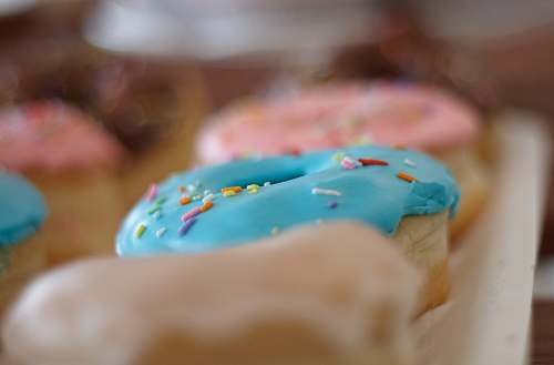 sweets close-up photo of donuts with sprinkles confectionery