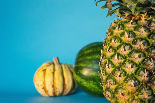 fruit close-up photo of pineapple, watermelon, and squash pineapple