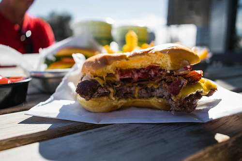 burger close-up photography of hambuger on white textile human