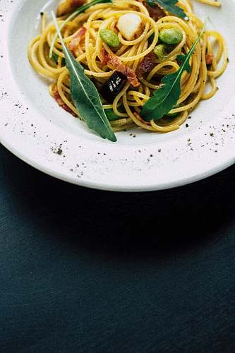 pasta cooked noodles on white ceramic bowl spaghetti