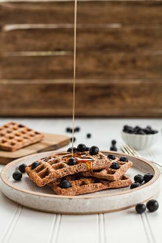 waffle cooked pastries on white plate breakfast