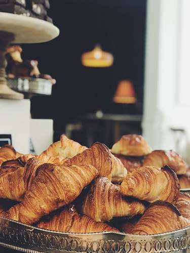 bread croissant on top of stainless steel tray croissant