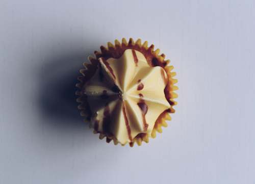 confectionery cupcake on white surface sweets