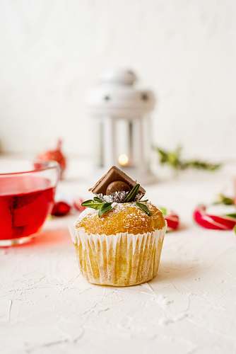 cream cupcake on white surface cupcake