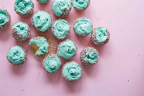 pink cupcake with teal icing lot cake