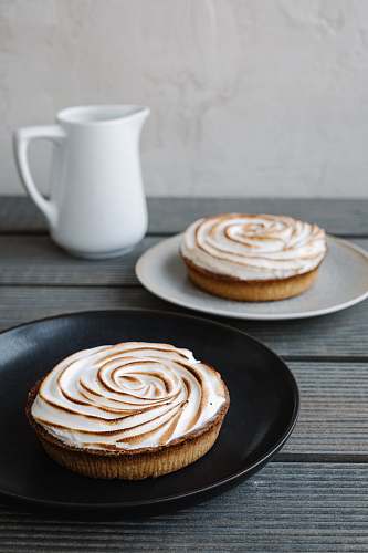 bread donut on white ceramic saucer pancake