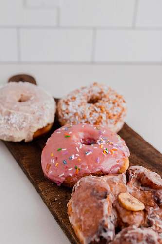 dessert doughnuts on wooden tray pastry