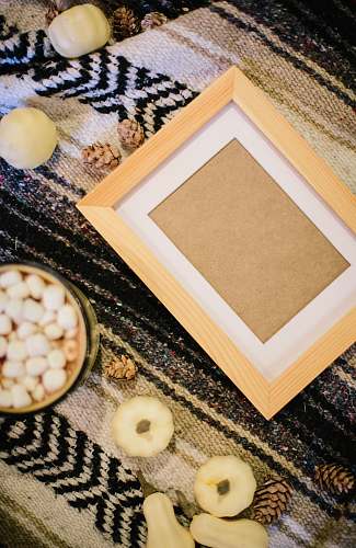 egg empty photo frame on black textile rug