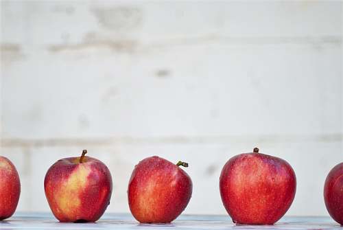 fruit five red apples on white surface apple