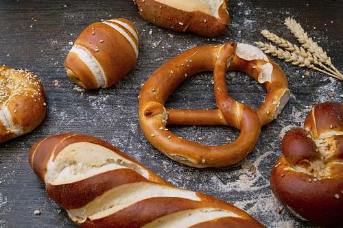 bread flat lay photography of breads pretzel