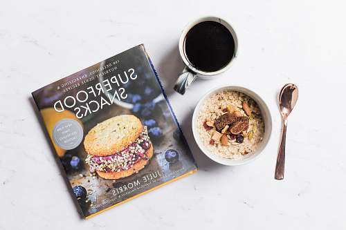 burger flat lay photography of coffee, Superfood Snacks magazine, and bowl of cereals spoon