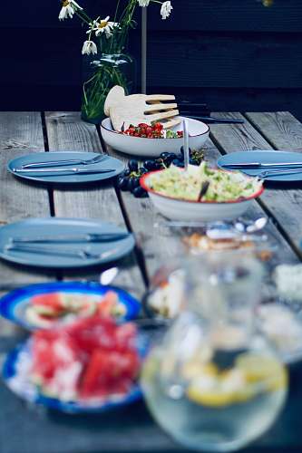 meal foods in bowl near plates on table restaurant