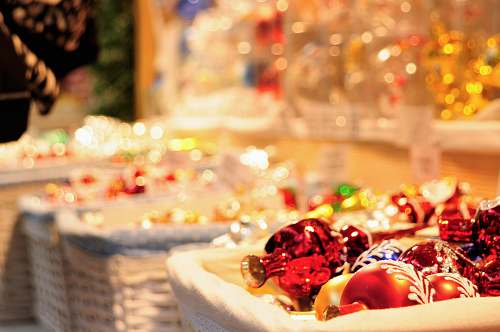 sweets four white wicker basket filled with Christmas decor lot selective focus photography confectionery