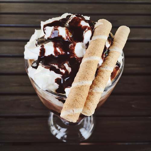 dessert frappe with chocolate crunch sticks on footed glass ice cream