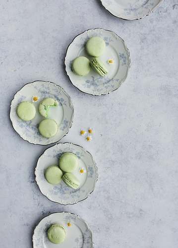 plant French macaroons on top of round plates egg