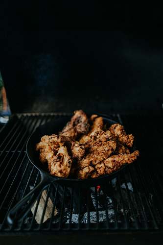 bbq fried meat in cast iron skillet fried chicken