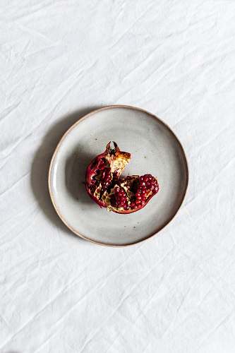 fruit fruit on white ceramic plate pomegranate