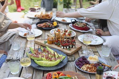 meal group of people eating on backyard restaurant