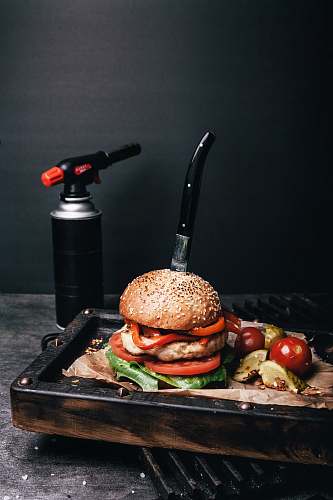 burger hamburger beside kitchen torch bread