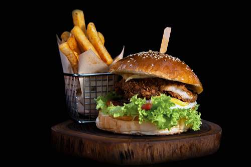 burger hamburger by french fries on board 