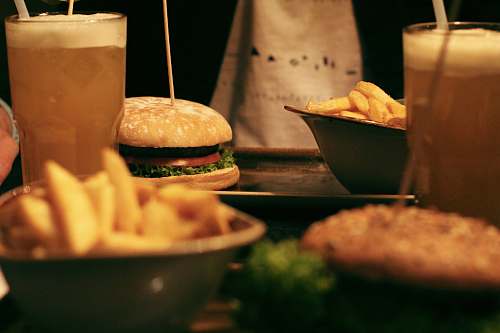 burger hamburger near drinking glass fries