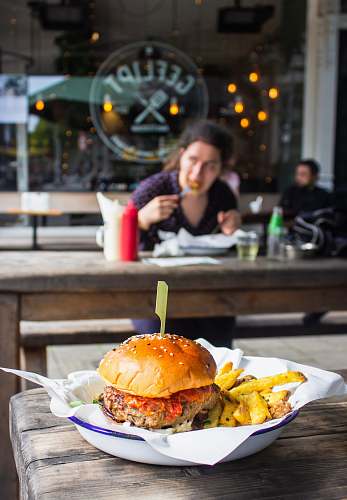 burger hamburger with fries in dish on table human