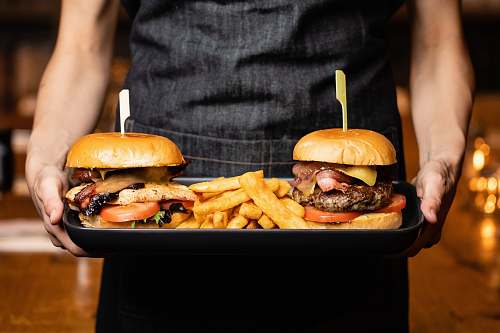 burger hamburgers and fries on tray human