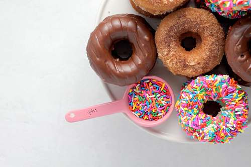 dessert high-angle photography of donuts on plate pastry