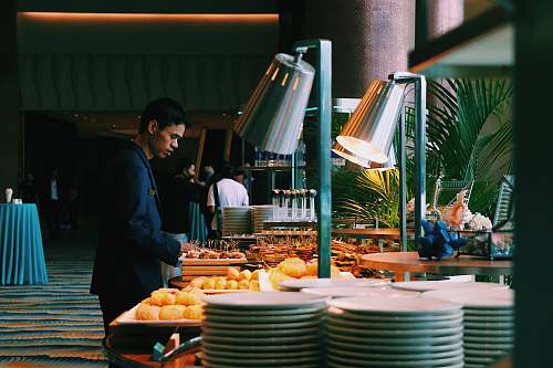 meal man pick some food at buffet table restaurant