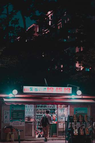 meal man standing at storefront human